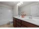 Bathroom featuring double sink vanity with ample counter space and decorative floral arrangement at 105 Concordia Woods Dr, Morrisville, NC 27560