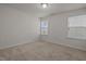 Cozy carpeted bedroom with two windows, white walls and plenty of natural light at 105 Concordia Woods Dr, Morrisville, NC 27560