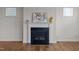 Close-up of a fireplace with artwork and decorations on the mantle at 105 Concordia Woods Dr, Morrisville, NC 27560