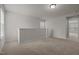 Bright loft space featuring neutral carpet, white walls, natural light, and a half wall at 105 Concordia Woods Dr, Morrisville, NC 27560