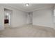 Spacious carpeted main bedroom with ample closet space, tray ceiling and access to main bathroom at 105 Concordia Woods Dr, Morrisville, NC 27560