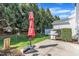 Outdoor patio features an umbrella, grill, and privacy fencing at 10707 Edmundson Ave, Raleigh, NC 27614
