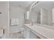 Bathroom with shower, sink, and plenty of light at 10707 Edmundson Ave, Raleigh, NC 27614