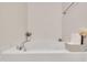 Relaxing soaking tub area with a stylish faucet and decorative accents for a spa-like experience at 10707 Edmundson Ave, Raleigh, NC 27614