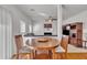 Breakfast nook near living room featuring a wooden table and view of fireplace at 10707 Edmundson Ave, Raleigh, NC 27614