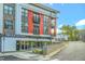 A modern building showcasing a wood-fired pizza restaurant and sleek architectural design at 10707 Edmundson Ave, Raleigh, NC 27614