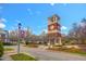 View of the community clock tower situated at the end of a street with manicured landscaping at 10707 Edmundson Ave, Raleigh, NC 27614