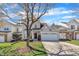Charming home with a well-manicured lawn, mature tree, and a two-car garage at 10707 Edmundson Ave, Raleigh, NC 27614
