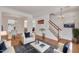 Bright living room with hardwood floors, white furnishings, and stylish decor at 10707 Edmundson Ave, Raleigh, NC 27614