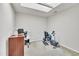 Versatile office space with a skylight, desk, and exercise equipment at 10707 Edmundson Ave, Raleigh, NC 27614