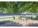 Community tennis courts and shaded gazebo offer a relaxing and active lifestyle at 10707 Edmundson Ave, Raleigh, NC 27614
