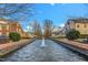 A water feature stretches down a green space between two properties at 10707 Edmundson Ave, Raleigh, NC 27614