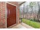 Back door featuring a brick surround with access to a natural wooded backyard at 109 Killam Ct # La, Cary, NC 27513