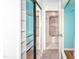 Walk-in closet with mirrored door leading to a shower and bathroom at 109 Killam Ct # La, Cary, NC 27513
