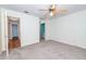 This carpeted bedroom has a ceiling fan and two doorways to other areas of the home at 109 Killam Ct # La, Cary, NC 27513