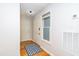 Welcoming entryway with a patterned rug and neutral paint colors at 109 Killam Ct # La, Cary, NC 27513