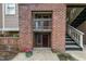Condo building exterior featuring brick, stairs and greenery at 109 Killam Ct # La, Cary, NC 27513