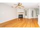 Spacious living room featuring hardwood floors, a cozy fireplace, and natural light at 109 Killam Ct # La, Cary, NC 27513