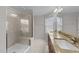 Modern bathroom with a glass walk-in shower and dual vanity sinks at 1103 Apogee Dr, Durham, NC 27713