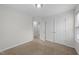 Bedroom with neutral walls and carpet features double closets and access to another room at 1103 Apogee Dr, Durham, NC 27713