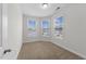 Bright bedroom features large windows offering ample natural light and neighborhood views at 1103 Apogee Dr, Durham, NC 27713