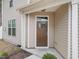 Exterior shot highlighting the front door and architectural details of the home at 1103 Apogee Dr, Durham, NC 27713