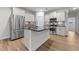 Modern kitchen features stainless steel appliances, center island, and stylish backsplash at 1103 Apogee Dr, Durham, NC 27713