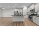 Modern kitchen features stainless steel appliances, granite countertops, and hardwood floors at 1103 Apogee Dr, Durham, NC 27713