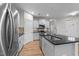 Bright kitchen with white cabinets, stainless steel appliances, and a granite island at 1103 Apogee Dr, Durham, NC 27713