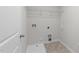 Practical laundry room featuring a utility sink, washer hookups, and an overhead wire rack at 1103 Apogee Dr, Durham, NC 27713