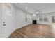 Bright living room with a fireplace, large windows, and hardwood flooring at 1103 Apogee Dr, Durham, NC 27713