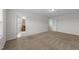 Spacious main bedroom with doorway view of an en-suite bathroom and large closets at 1103 Apogee Dr, Durham, NC 27713
