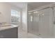 Modern bathroom with glass-enclosed shower, neutral color palette, and sink vanity at 1123 Latitude Dr, Durham, NC 27713