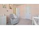 A serene Bedroom featuring a plush glider chair and soft pink walls, perfect for relaxation at 1123 Latitude Dr, Durham, NC 27713