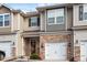 Charming townhome with stone accents, attached garage, and neutral siding at 1123 Latitude Dr, Durham, NC 27713