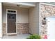 Close-up of front entry shows stone accents and craftsman style door at 1123 Latitude Dr, Durham, NC 27713