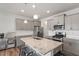Bright kitchen features stainless steel appliances, an island and gray cabinets at 1123 Latitude Dr, Durham, NC 27713