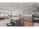 Open kitchen and living area boasts stainless appliances, island and lots of natural light at 1123 Latitude Dr, Durham, NC 27713
