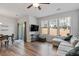 Open concept living room with dining area, plush sofa, and bright natural light at 1123 Latitude Dr, Durham, NC 27713
