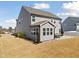 A spacious backyard featuring a covered patio and outdoor seating, perfect for outdoor relaxation at 115 Cliffview Dr, Garner, NC 27529