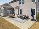 Spacious stamped concrete patio featuring outdoor dining and seating areas, perfect for entertaining in the backyard at 115 Cliffview Dr, Garner, NC 27529