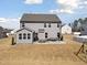 Spacious backyard with patio featuring dining and lounge sets at 115 Cliffview Dr, Garner, NC 27529