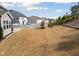 Expansive backyard with a play set, a white fence, and lush green surroundings at 115 Cliffview Dr, Garner, NC 27529