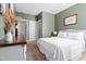 Bedroom showcases neutral colors, natural light, and closet creating a warm and inviting retreat at 115 Cliffview Dr, Garner, NC 27529