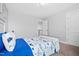 Bright bedroom featuring a dinosaur themed bed set and neutral walls at 115 Cliffview Dr, Garner, NC 27529