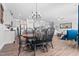 Dining area adjacent to kitchen with chandelier and seating for six at 115 Cliffview Dr, Garner, NC 27529