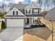 Beautiful two-story home with well-manicured front yard and a welcoming front porch at 115 Cliffview Dr, Garner, NC 27529