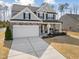 Charming two-story home with a large front lawn and attached two car garage at 115 Cliffview Dr, Garner, NC 27529