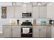 Well-appointed kitchen with granite countertops, stainless steel appliances, and stylish fixtures at 115 Cliffview Dr, Garner, NC 27529