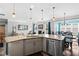 Open concept kitchen featuring granite countertops, stainless steel appliances, island with sink, and view of the living room at 115 Cliffview Dr, Garner, NC 27529